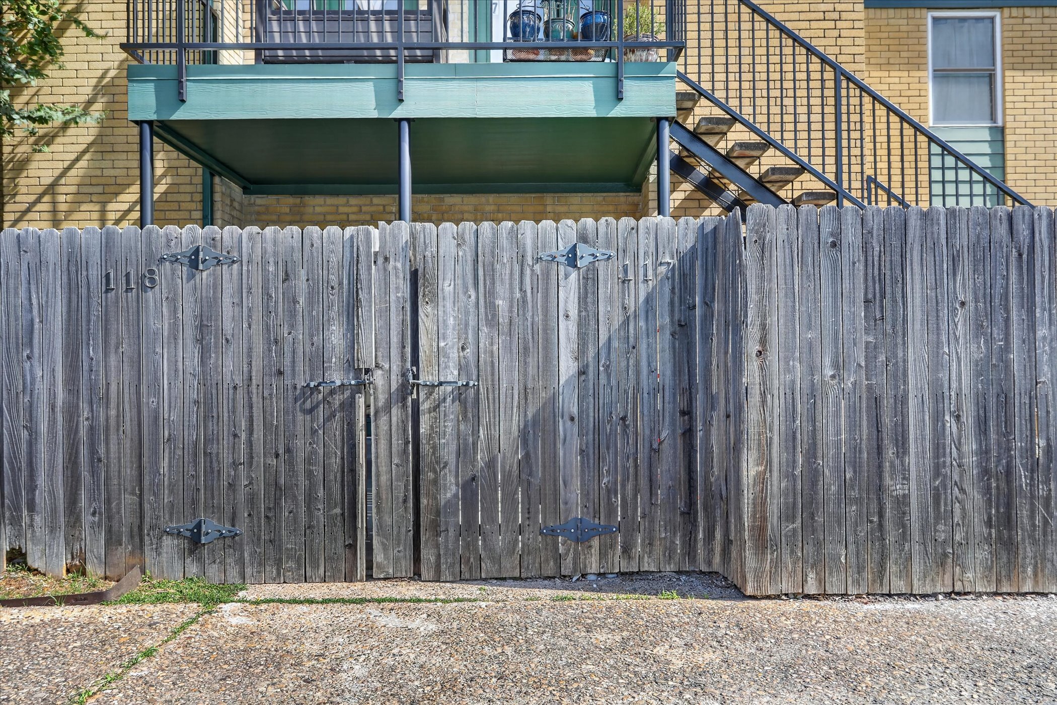 Unit 117 private outdoor space fenced and gated at 6020 E University Blvd Dallas