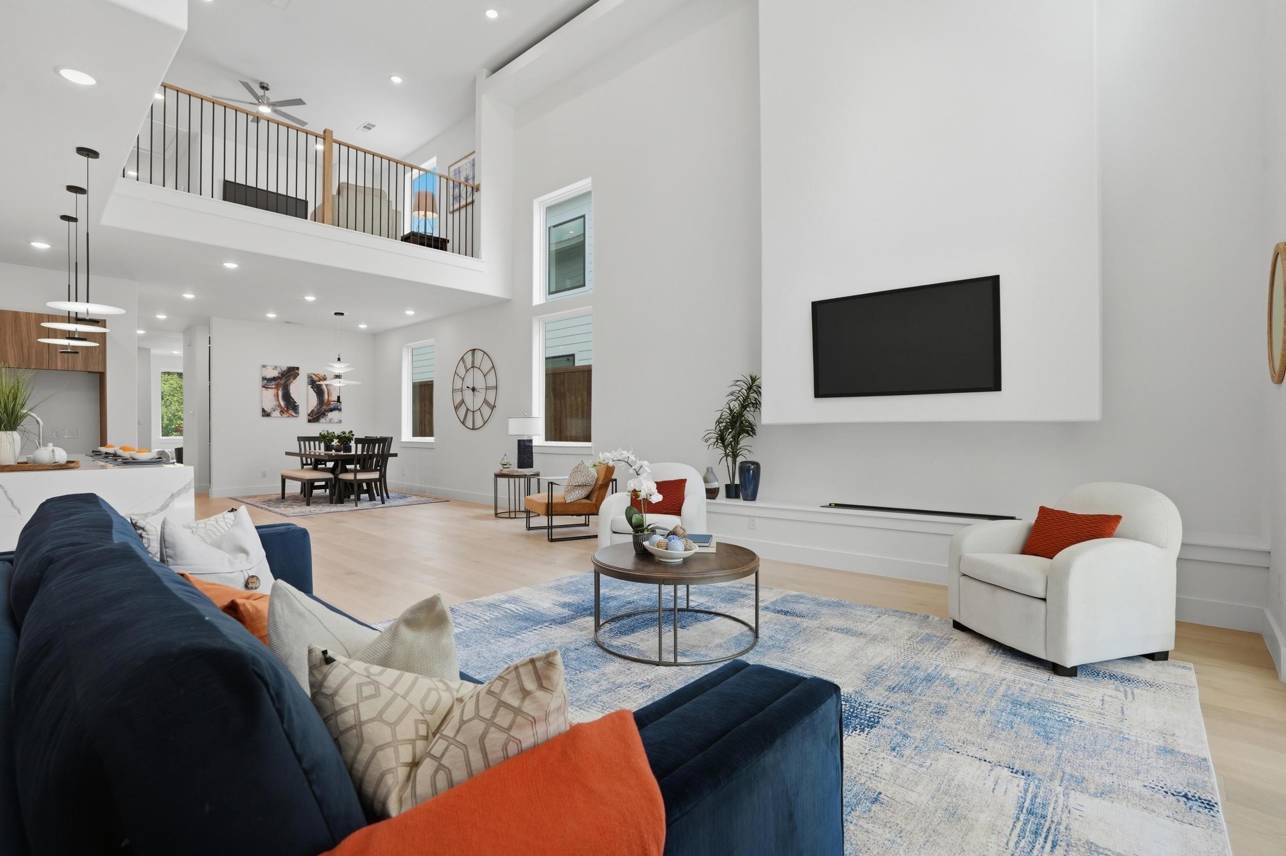 Double-height living room with linear fireplace at 617 Parkview Ave Dallas
