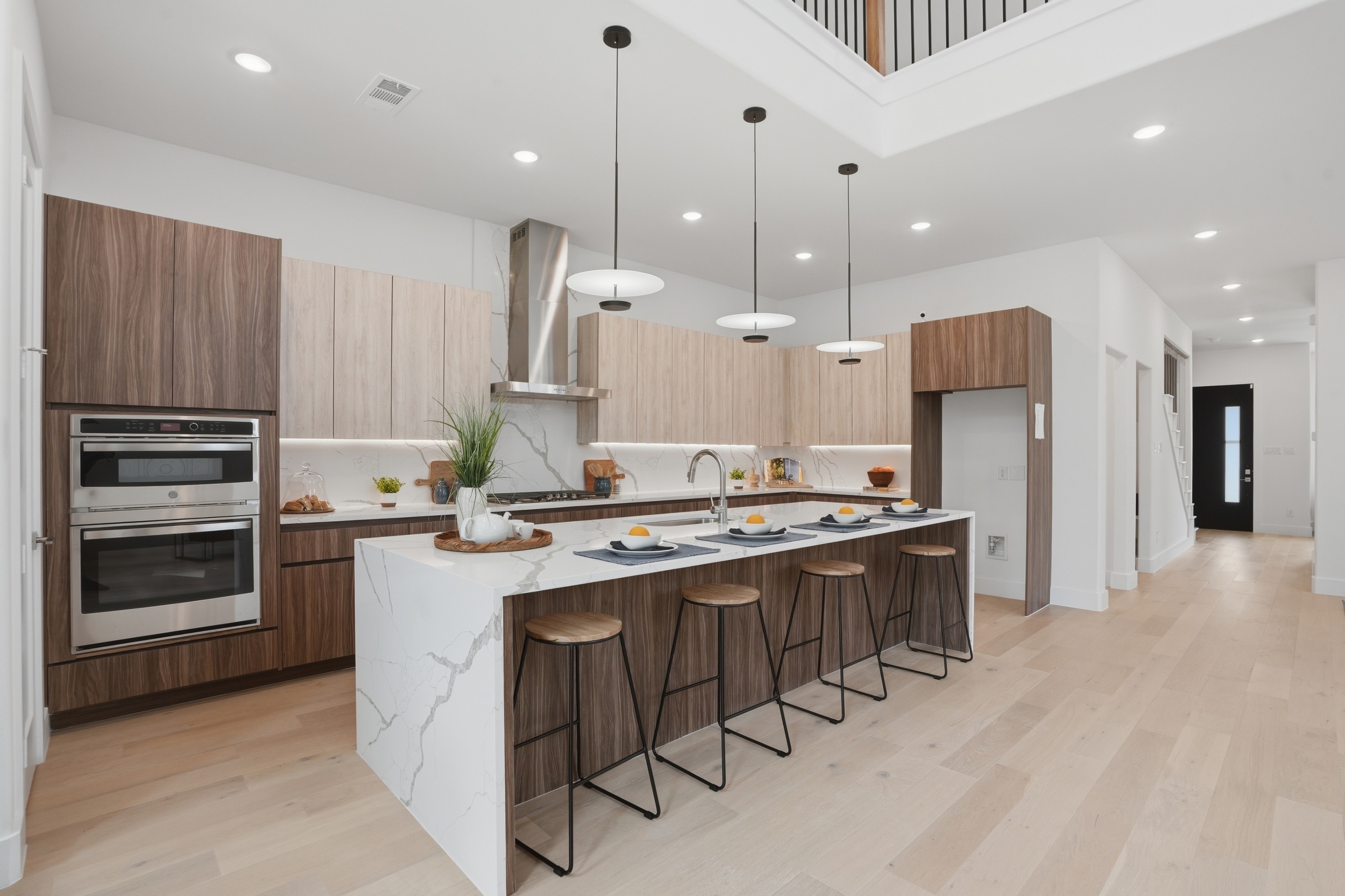 Chef's kitchen with Calacatta quartz waterfall island at 617 Parkview Ave Dallas TX 75223
