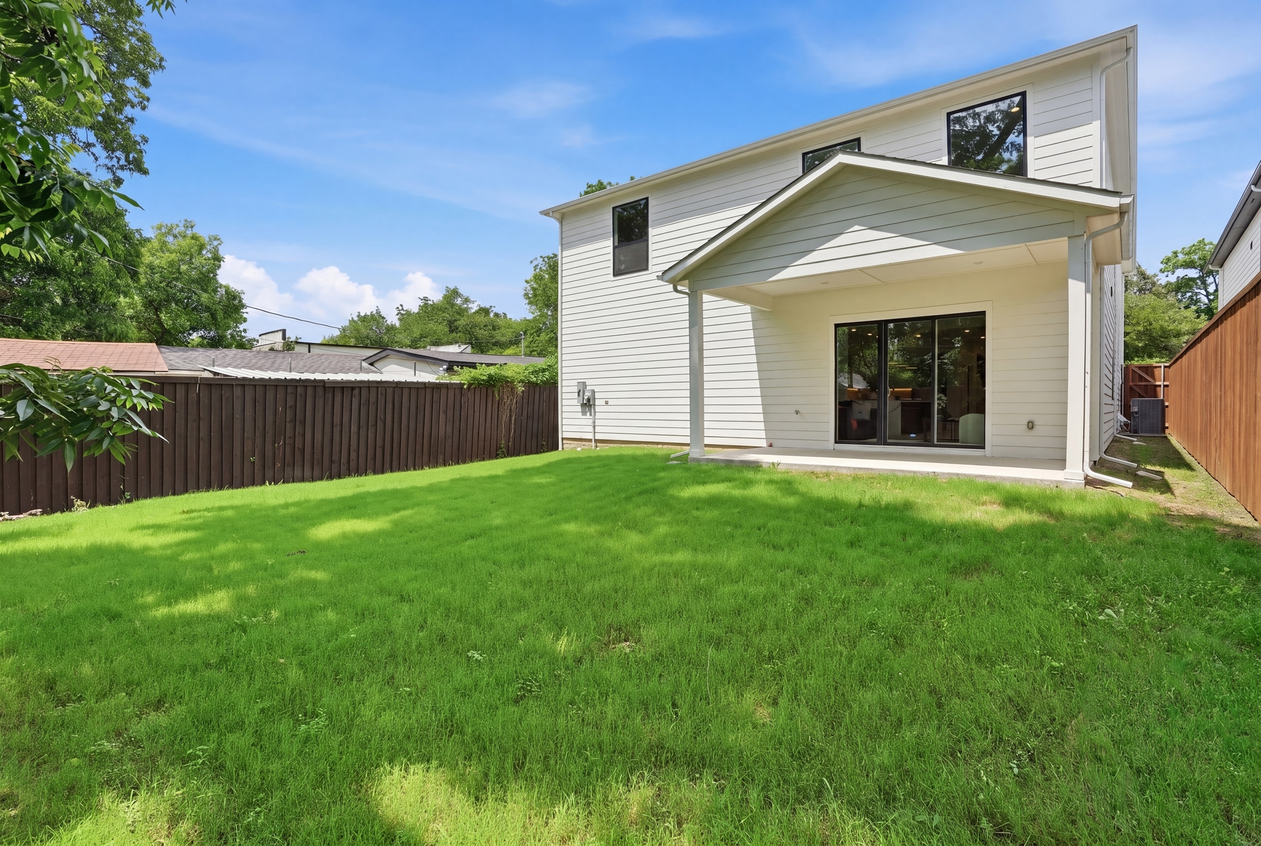 Pool-ready backyard with 179 sq ft covered porch and 8ft cedar fence at 617 Parkview Ave