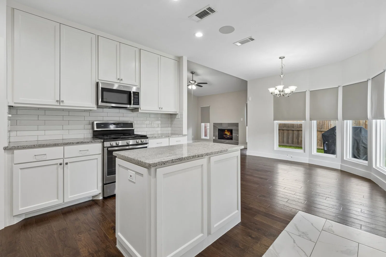 Kitchen island and stainless appliances at 7406 Bayview Drive