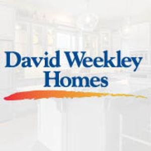 David Weekley home with a front porch and large windows on a Laureate Park street in Lake Nona