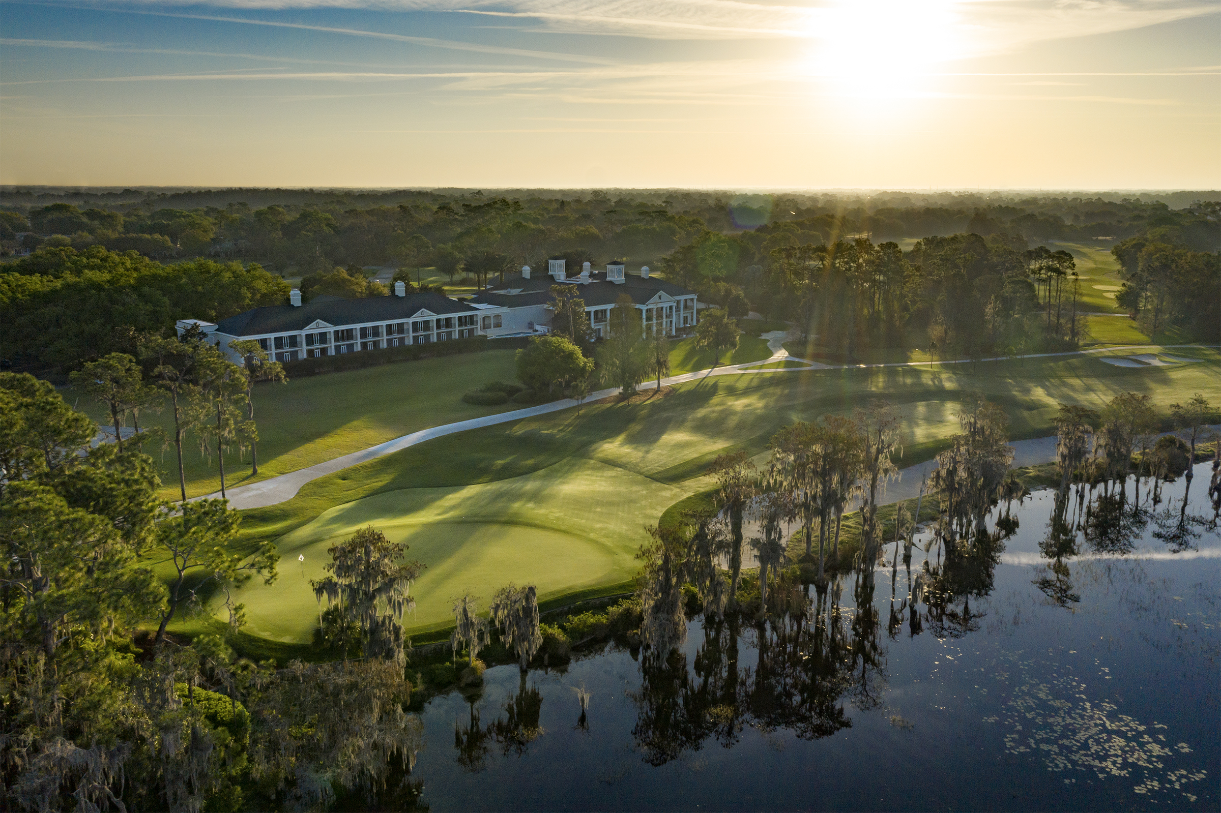 Oak-lined fairway and lake frontage at Lake Nona Golf and Country Club, the Tom Fazio course opened in 1986