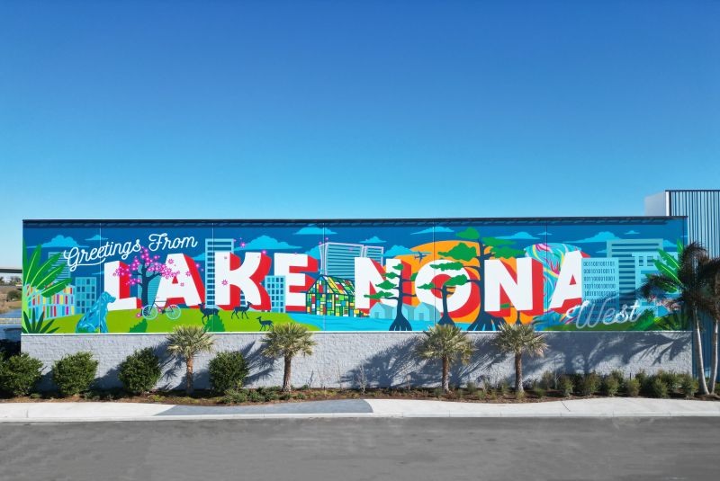Chalk & Brush mural on a building wall at Lake Nona West shopping center