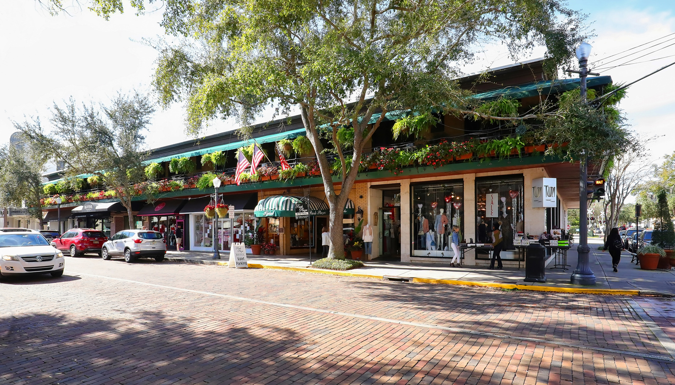 Shops and trees along Park Avenue in Winter Park, Florida
