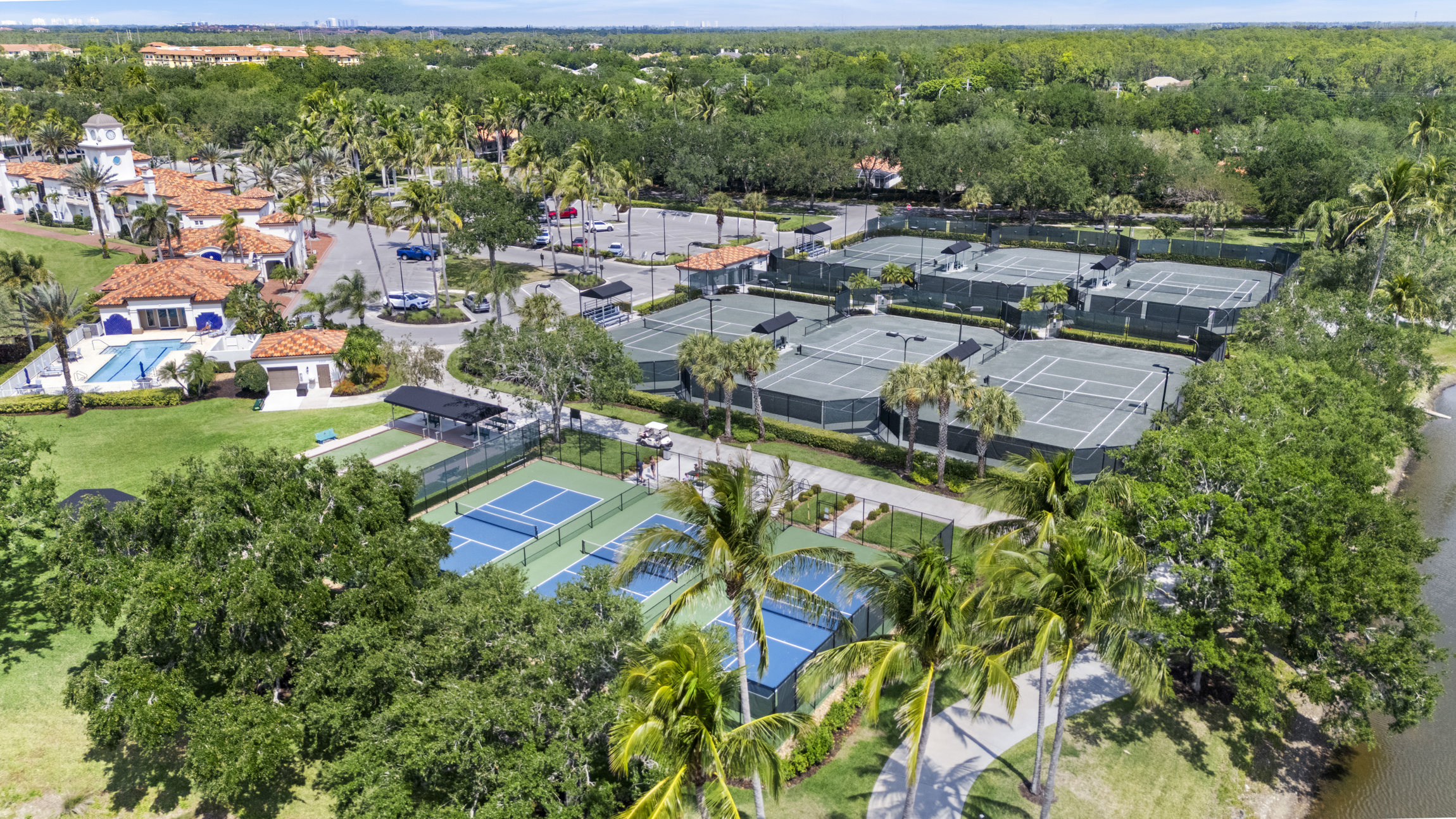 Village Walk of Naples Town Center clubhouse and tennis courts