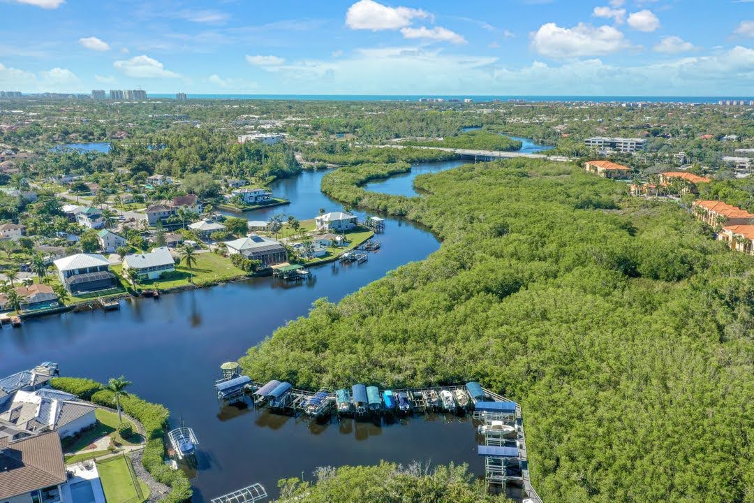 Aerial view of quiet luxury waterfront homes along the Imperial River in Bonita Springs, Florida