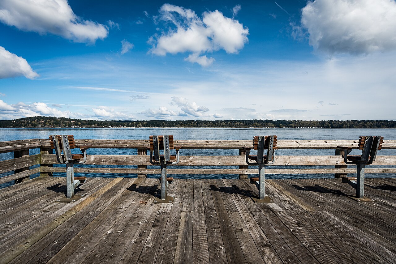 Seating on a waterfront deck in Campbell River looking across Discovery Passage to Quadra Island