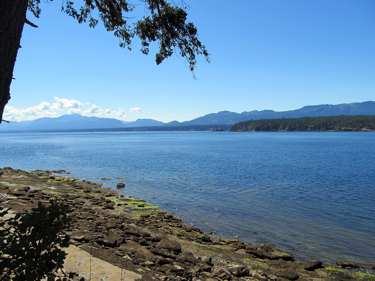 Rocky shoreline at Ford's Cove on Hornby Island looking toward Denman and Vancouver Island