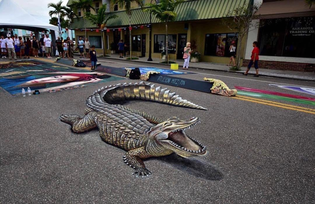 A picture containing reptile, animal, building, outdoorDescription automatically generated