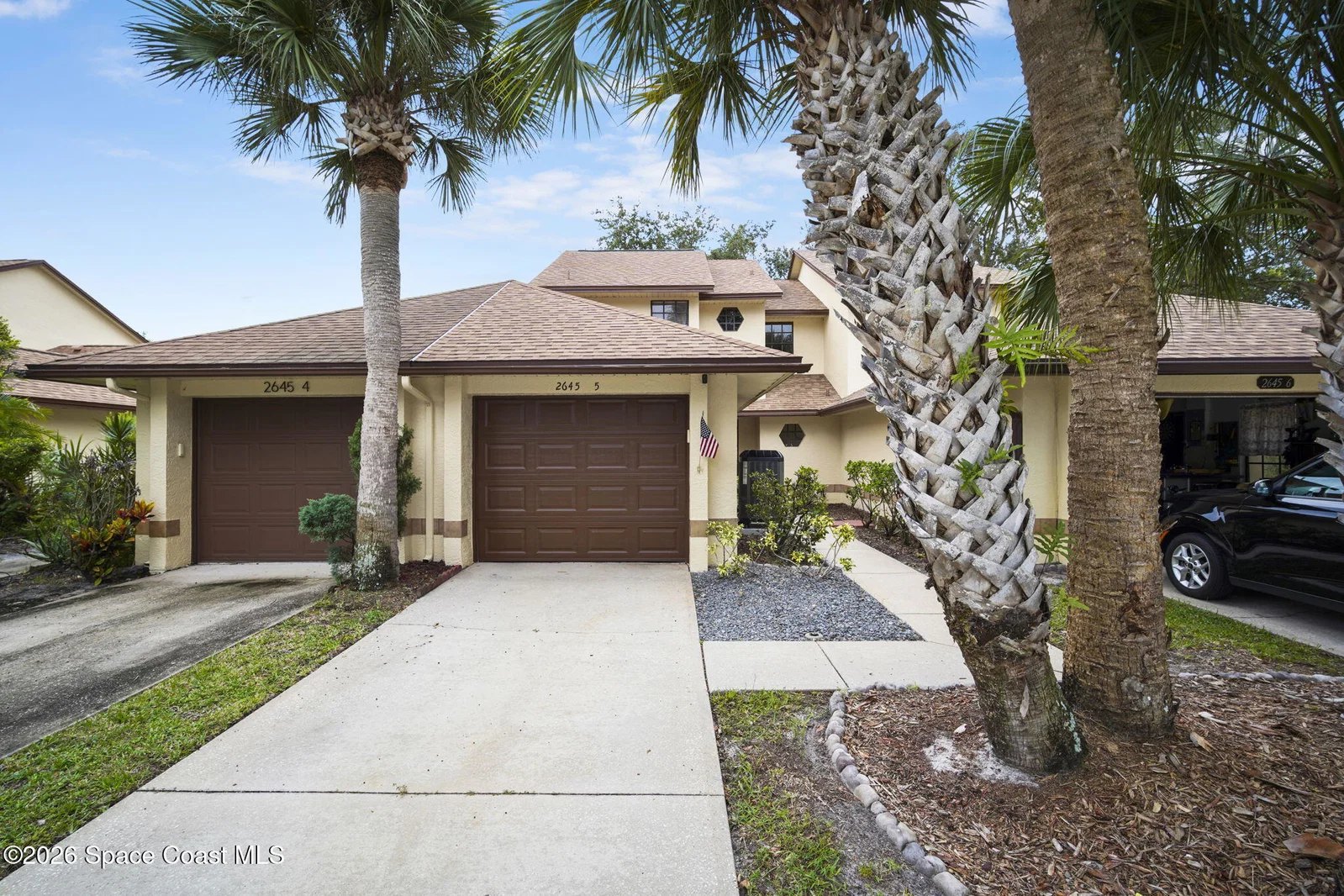 Front exterior and 1-car garage of 2645 Elliot Way #5, a Weston Park townhome in Melbourne FL