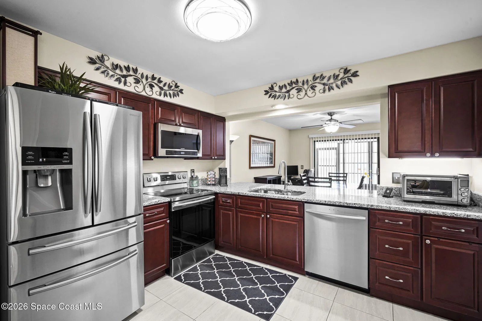 Remodeled kitchen with stainless steel appliances at 2645 Elliot Way, Melbourne FL