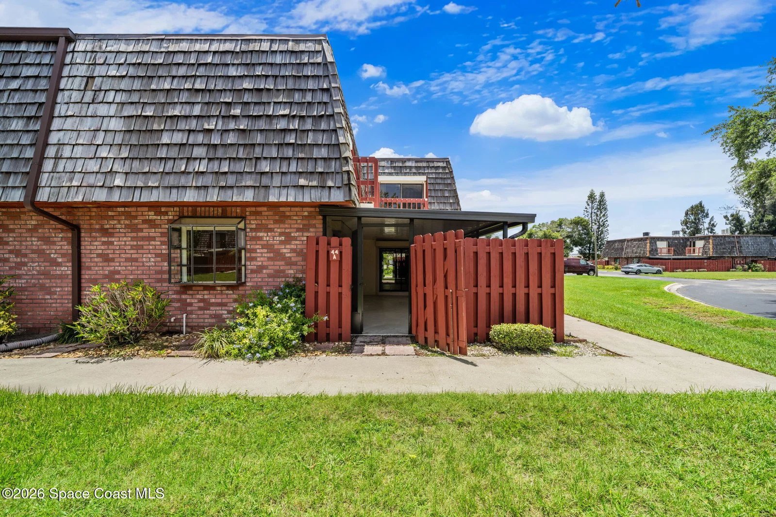Front entry courtyard at 44 Piney Branch Way, Chateau in the Pines