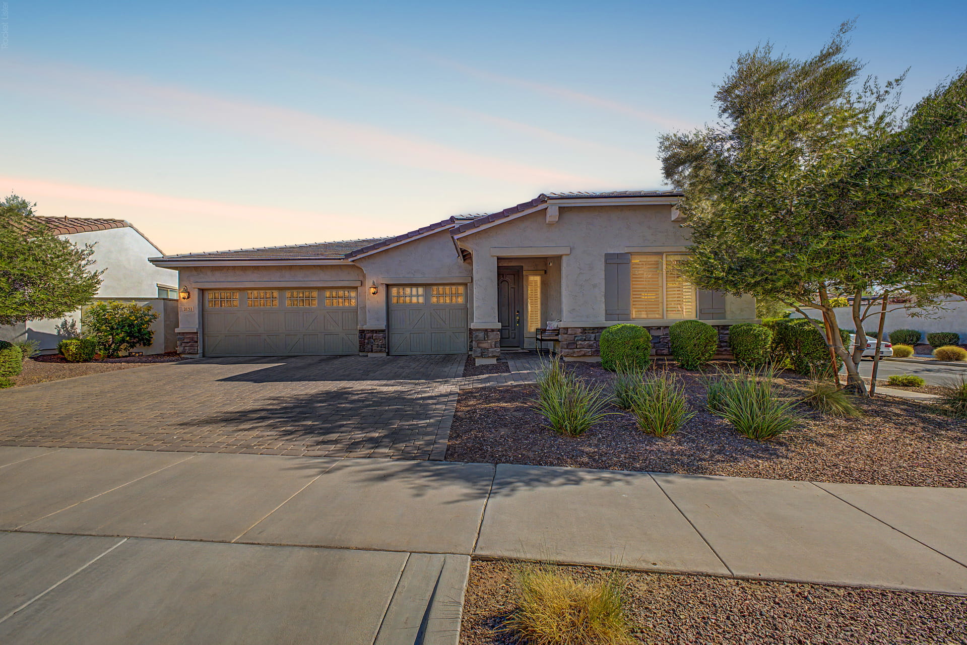 2151 N Beverly Place Buckeye Verrado single-level home with mountain views and a fire-pit patio