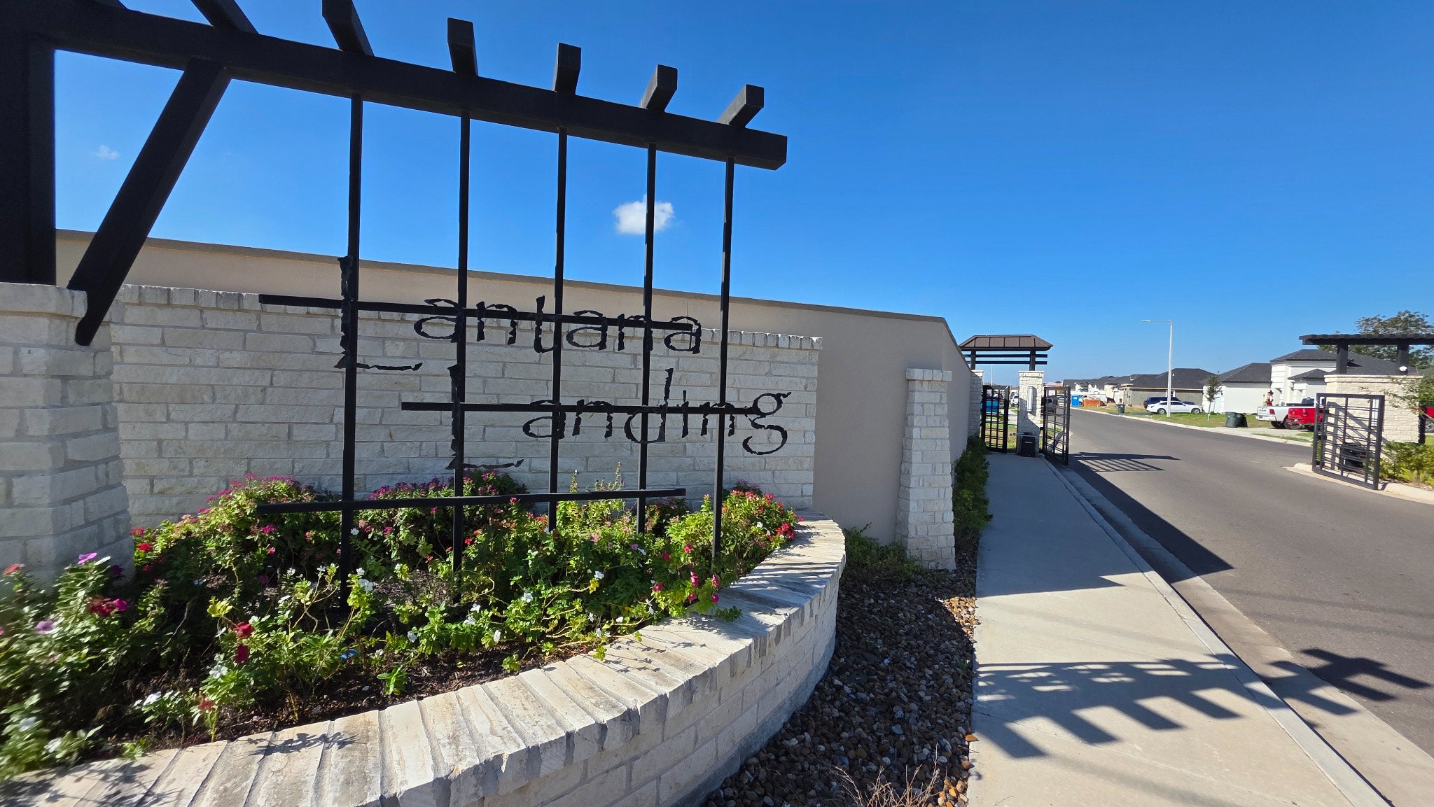 Gated entry to Lantana Landing in Mission, TX, featuring controlled access and modern design.