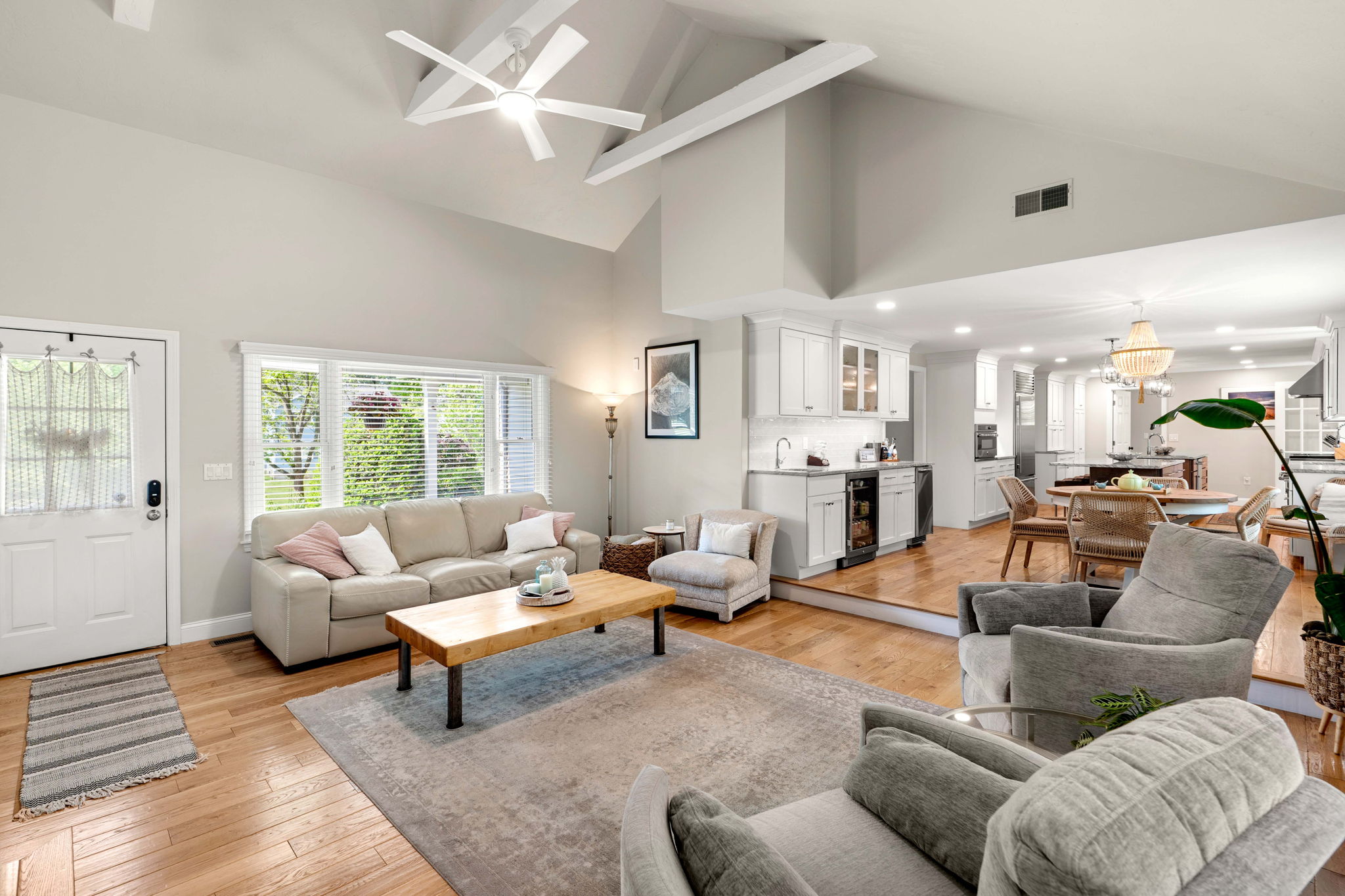 Vaulted living room with fireplace and hardwood floors at 10 Captain Circle Tewksbury