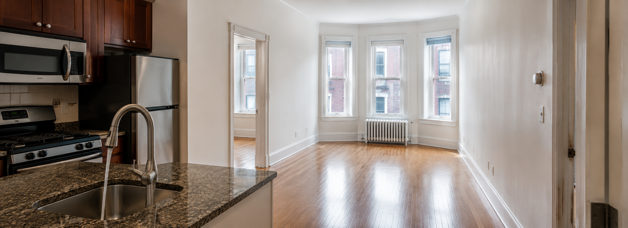 Buyer inspecting an empty 2BR condo