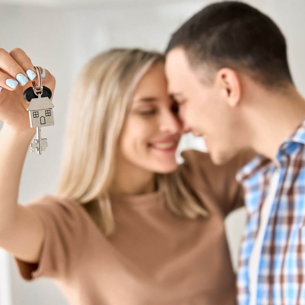 First-time buyers touring homes with a realtor