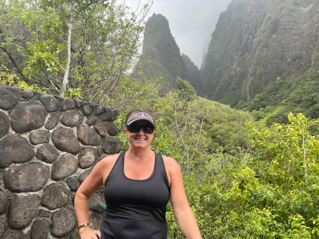Image of Robyn from the Maui Luxury Team posing on a hike in the Iao Valley.