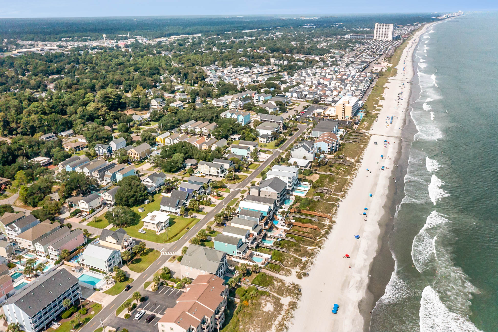 Aerial photograph of Surfside Beach, South Carolina, showing beachfront homes and the Atlantic Ocean