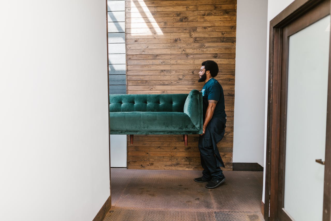 professional mover carrying a heavy sofa