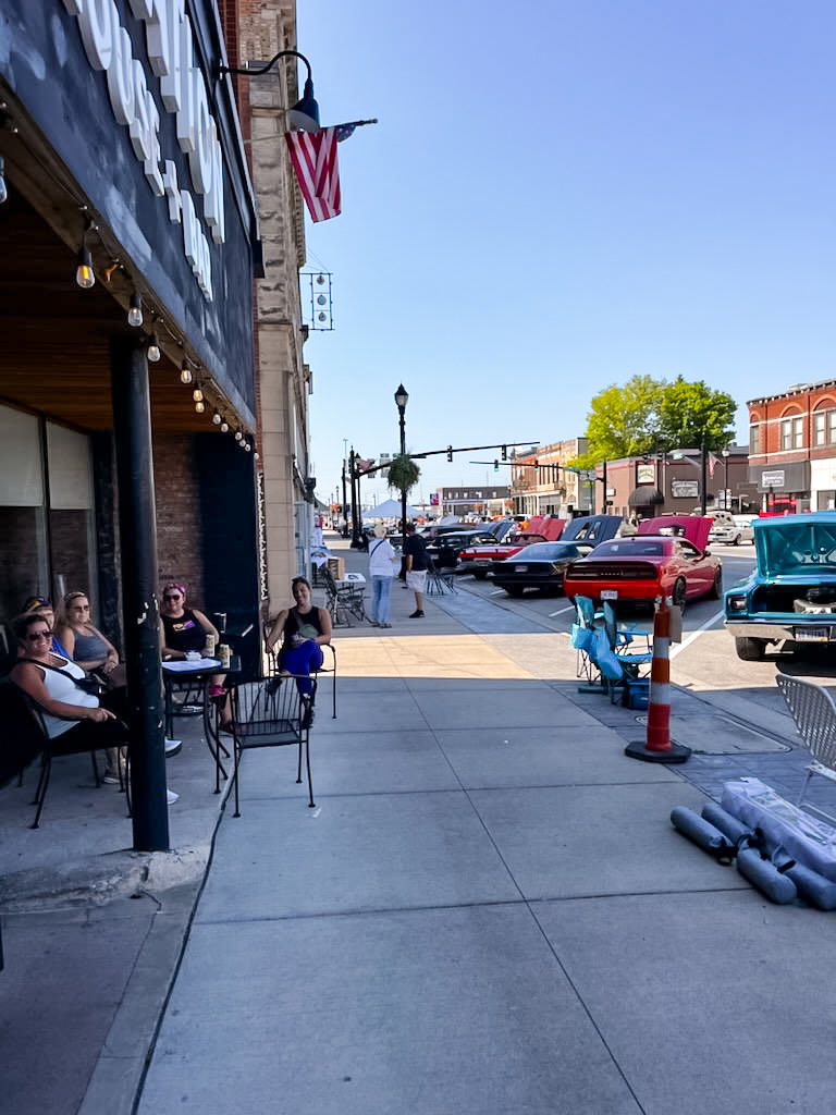 Classic cars and visitors along a downtown Celina street