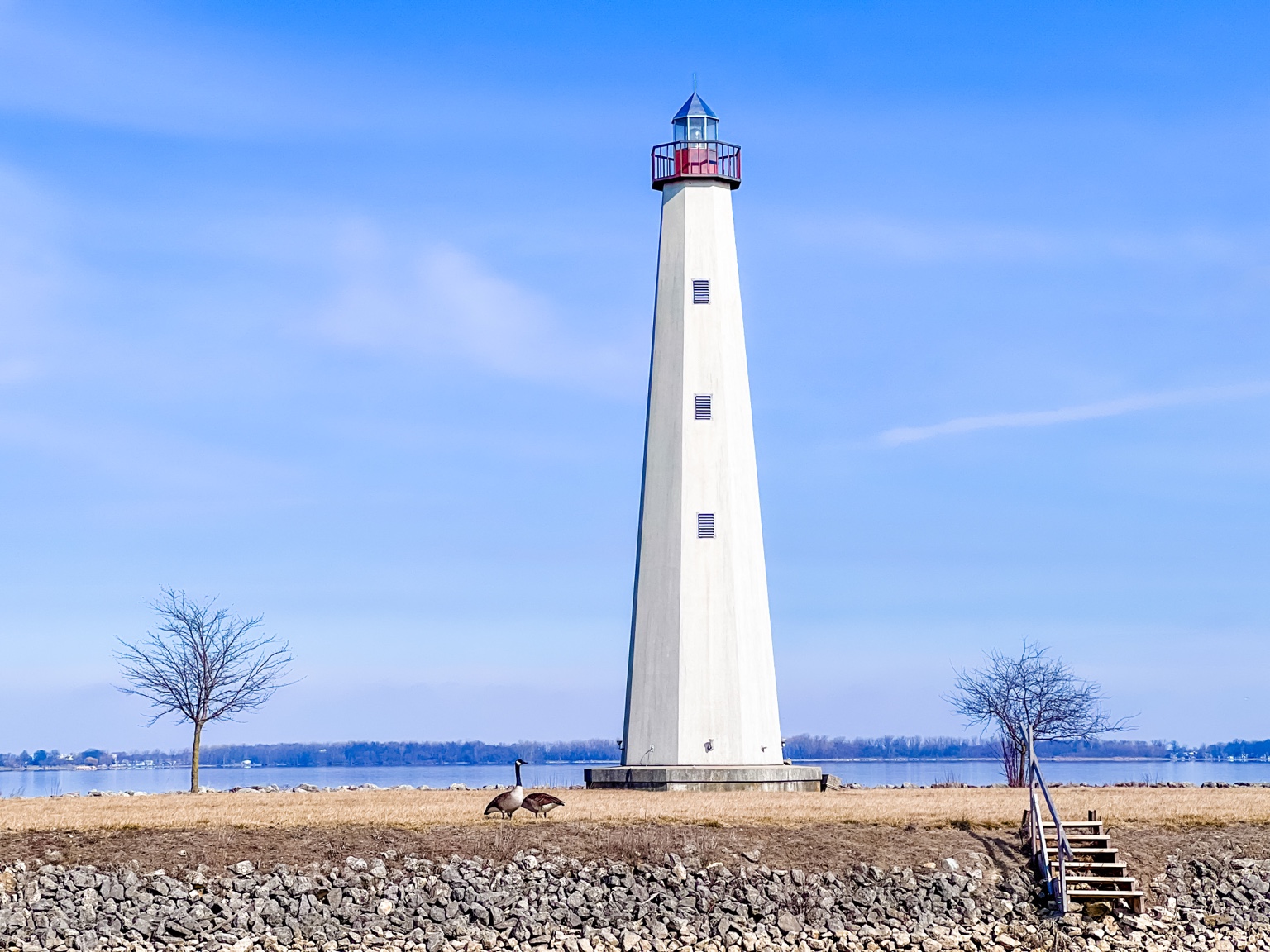 Behm's Grimm Memorial Lighthouse on Grand Lake St. Marys with Canada geese in the foreground