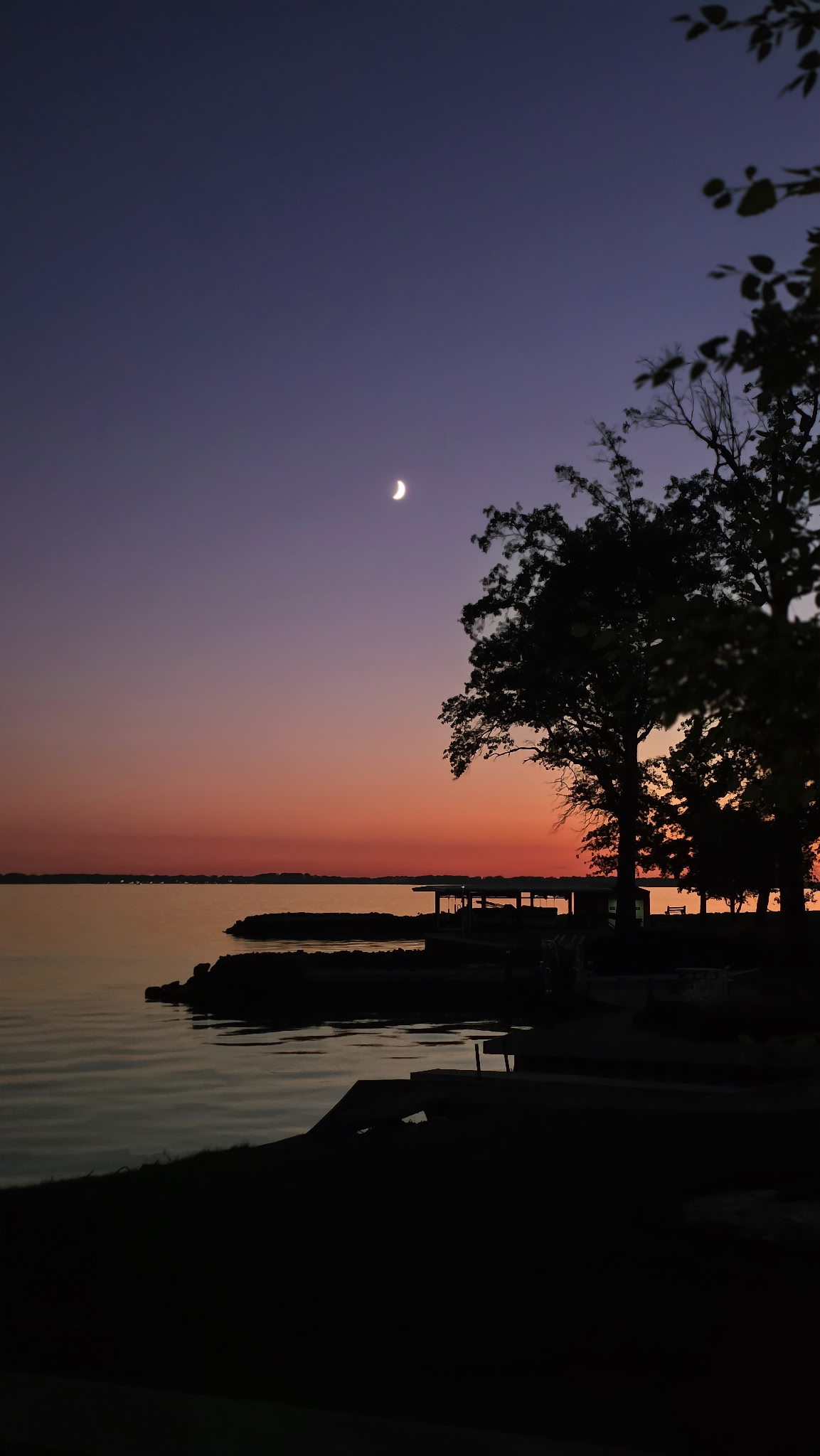 Crescent moon above Grand Lake St. Marys at dusk