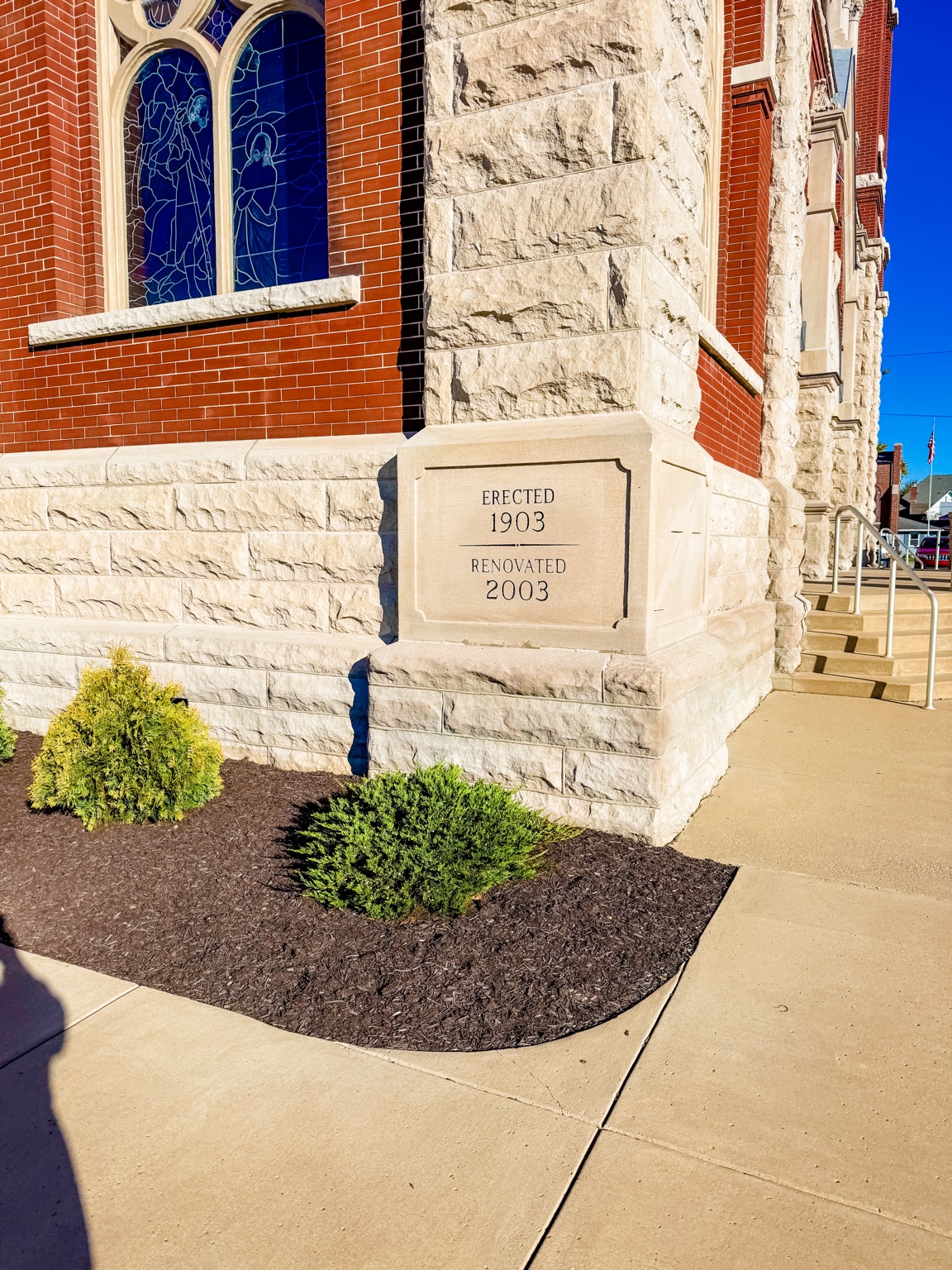 Stone cornerstone marking 1903 construction and 2003 renovation