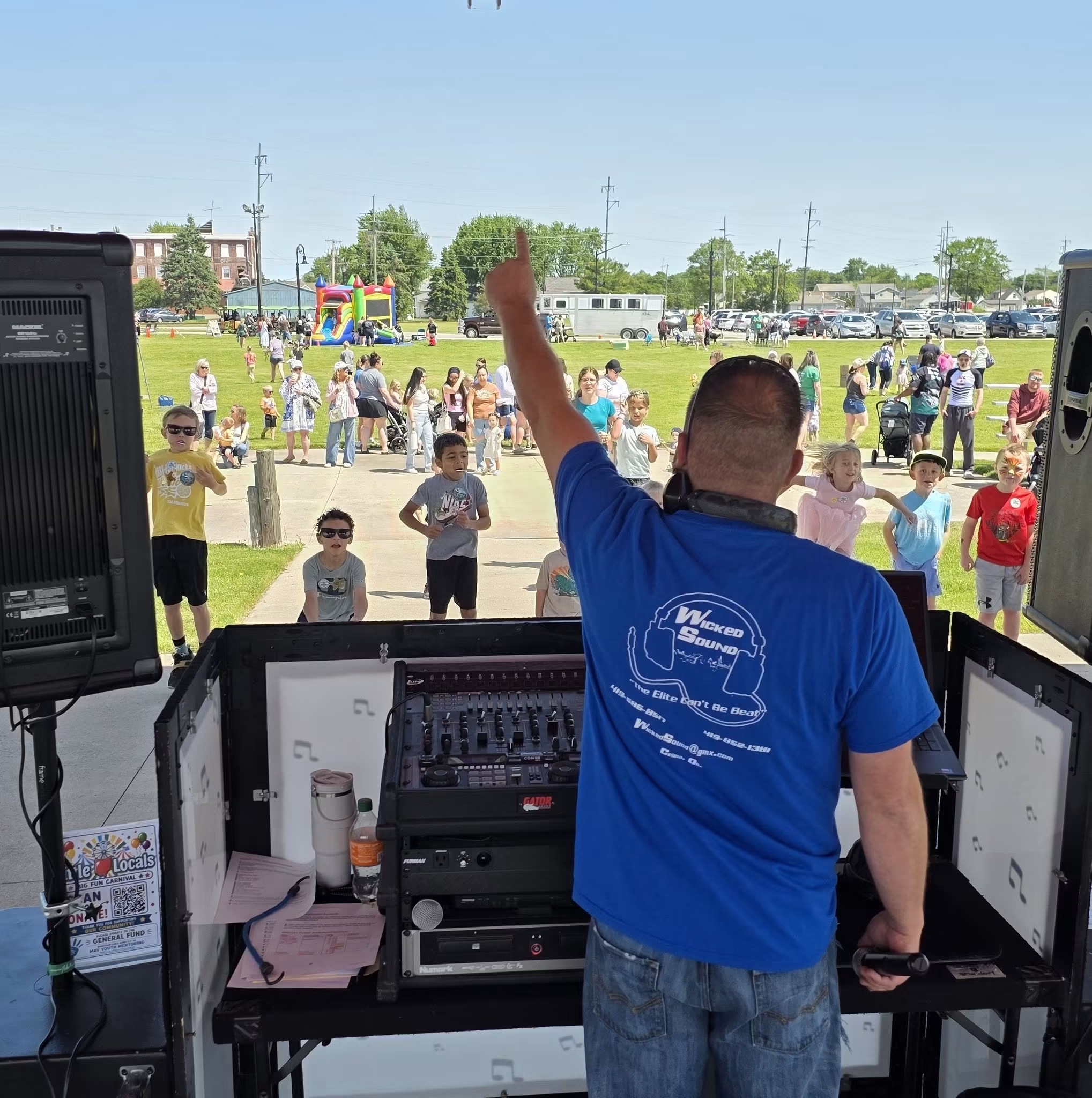 Children and families enjoying music and dancing together at a Little Locals community carnival in Celina Ohio