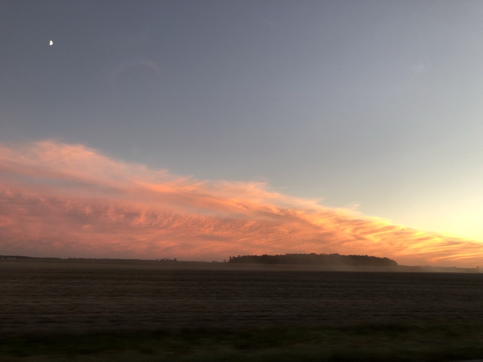 Pink and orange sunset above rural Mercer County Ohio fields