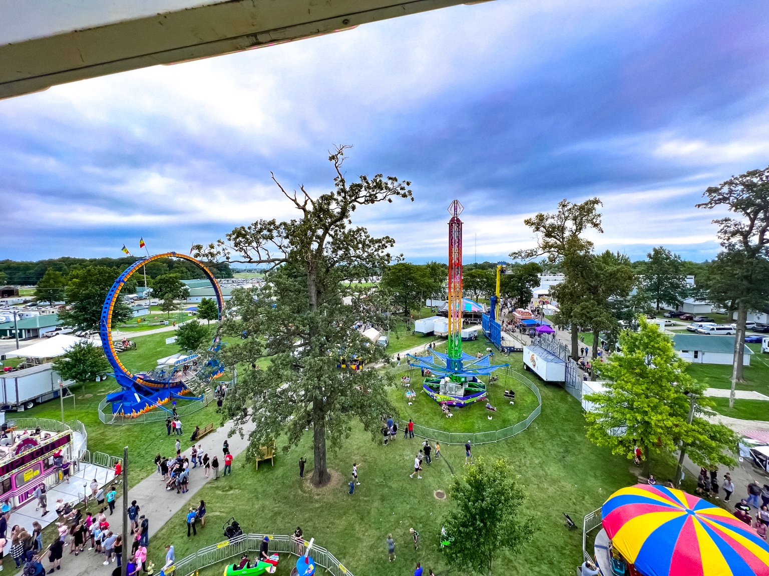 Aerial view across carnival rides and fairgoers at the Mercer County Fair in Celina Ohio