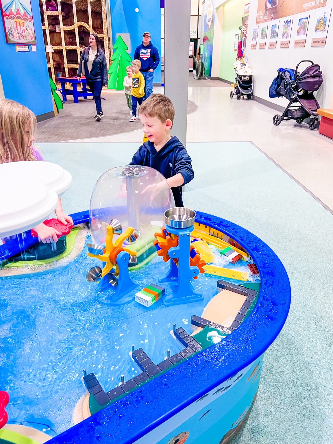 Hands-on water play at Muncie Children's Museum photographed by Master Key Realty