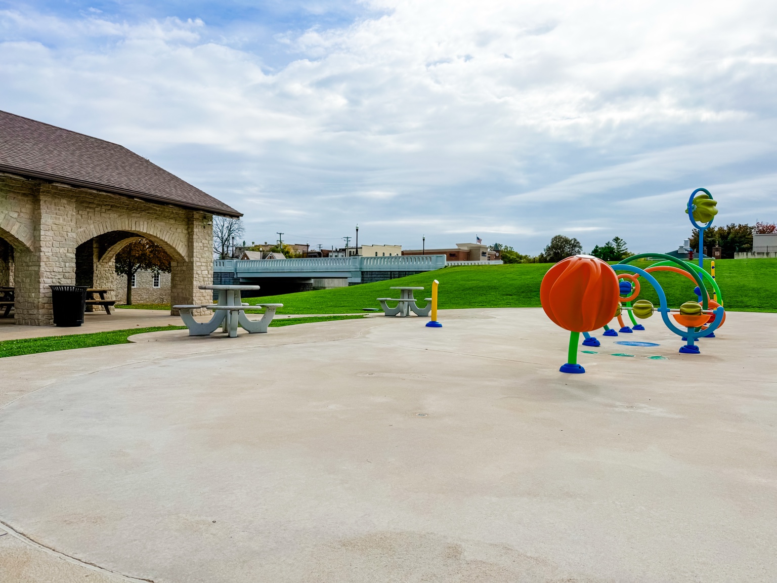 Colorful splash pad structures and picnic shelter in St. Marys Ohio
