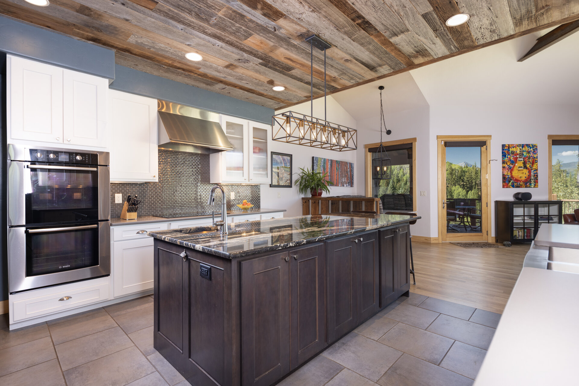 Kitchen with wall oven, gas range and custom cabinetry