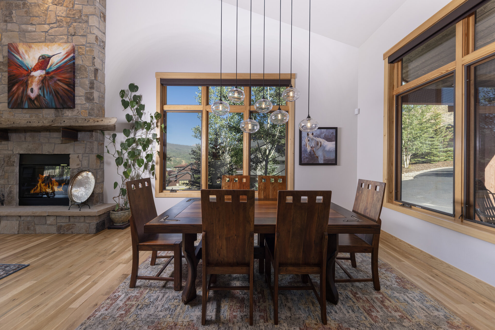 Dining space with stone fireplace