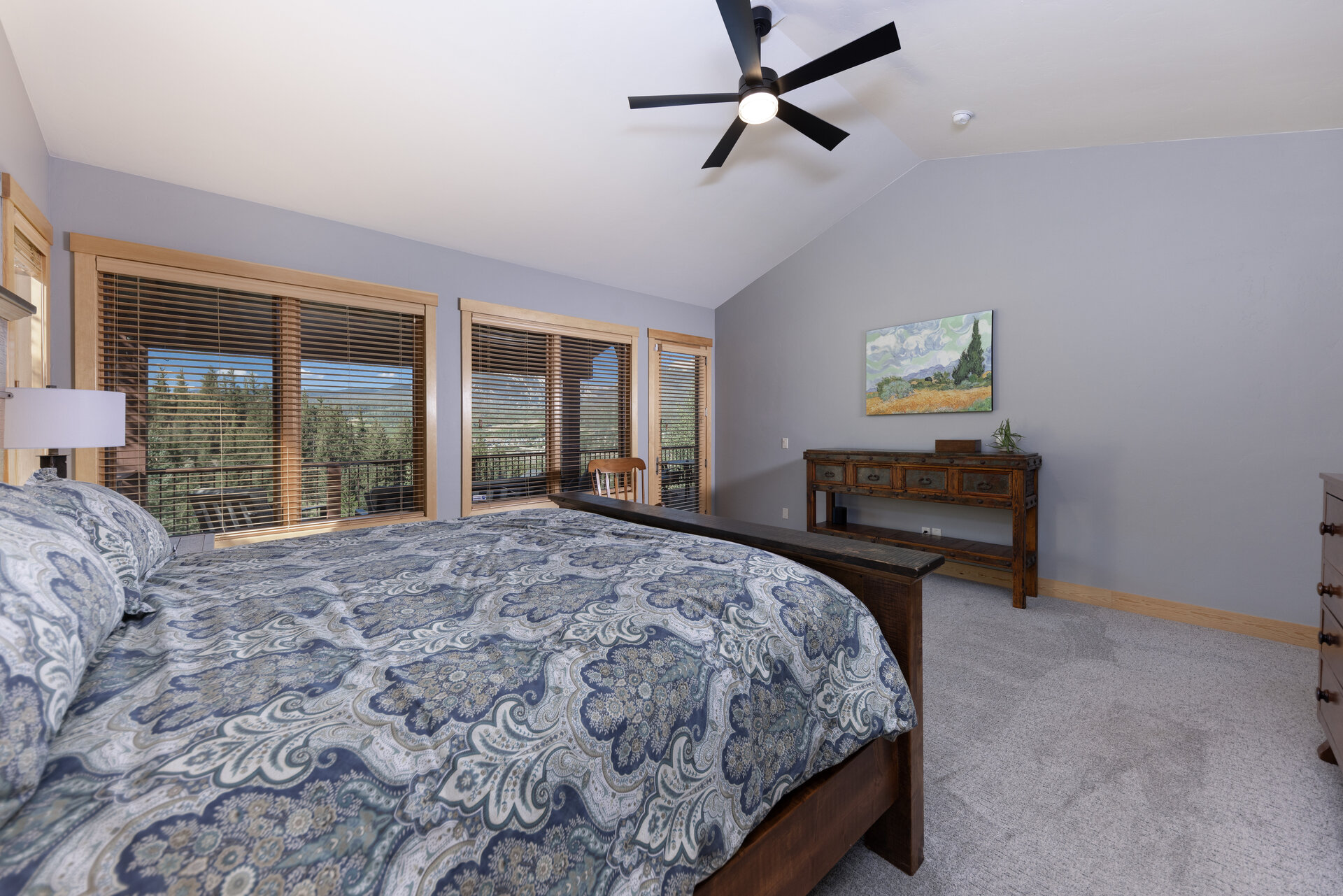 Main level primary bedroom with mountain views