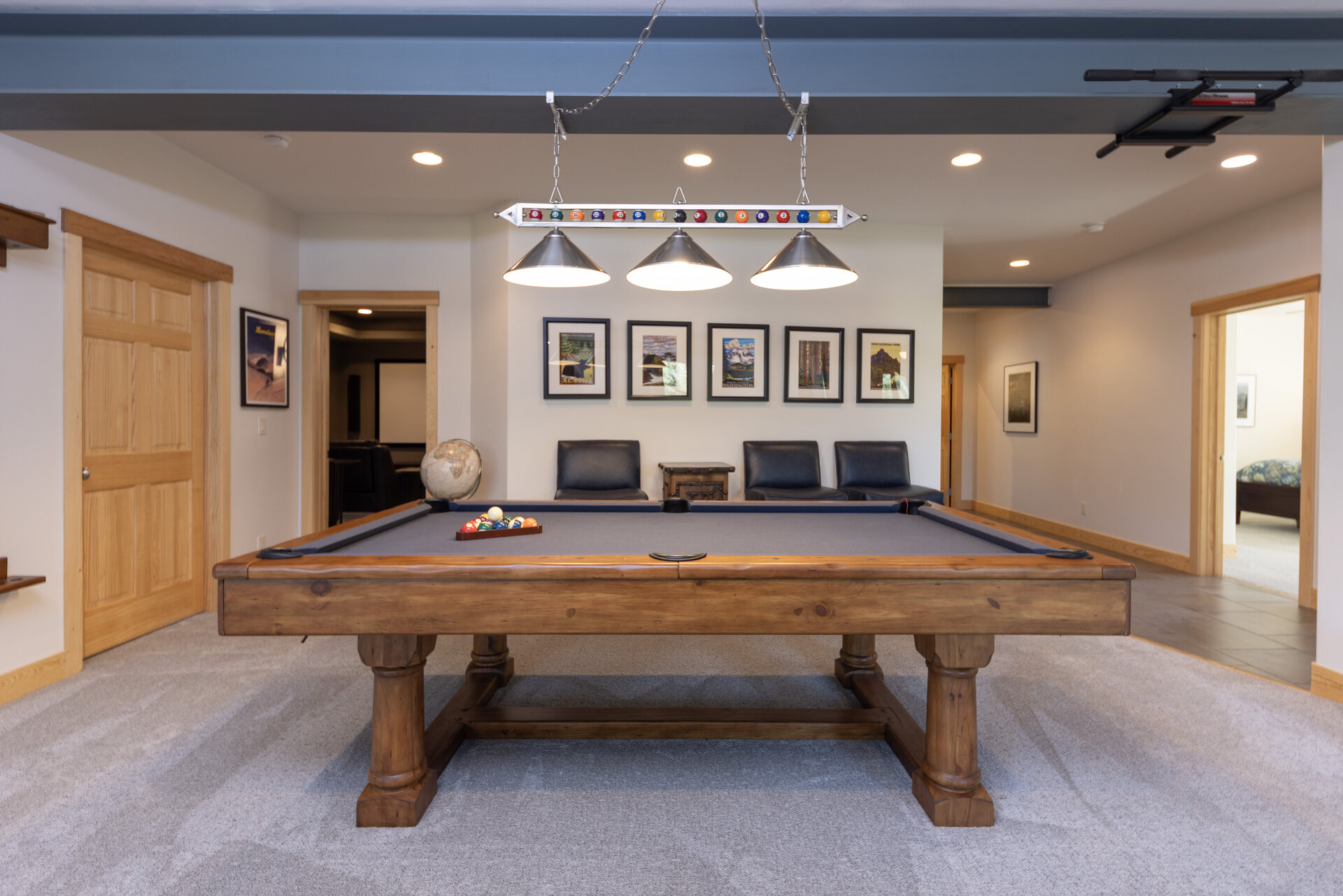 Billiards room with pendant lighting