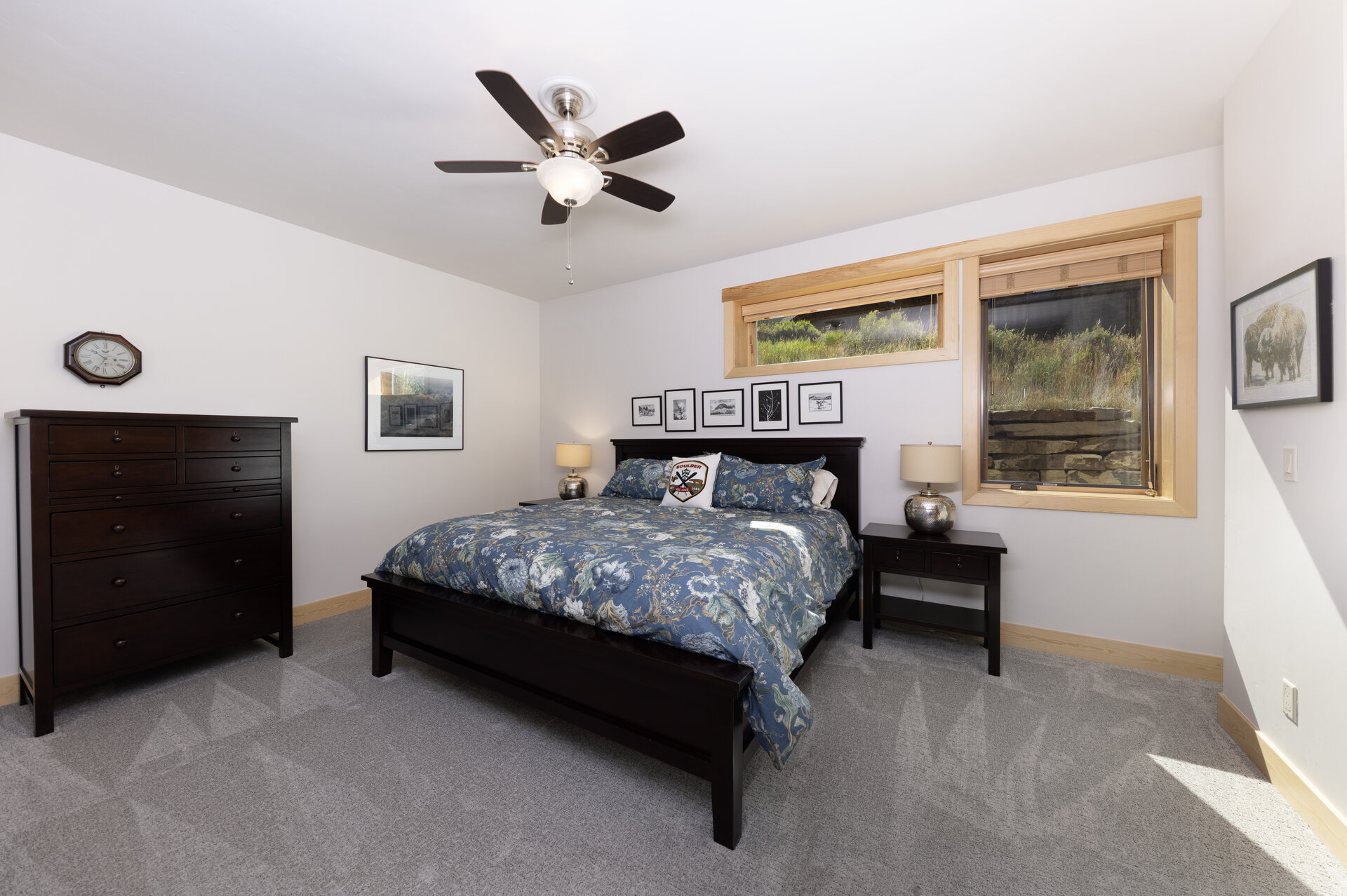 Guest bedroom with framed art and view