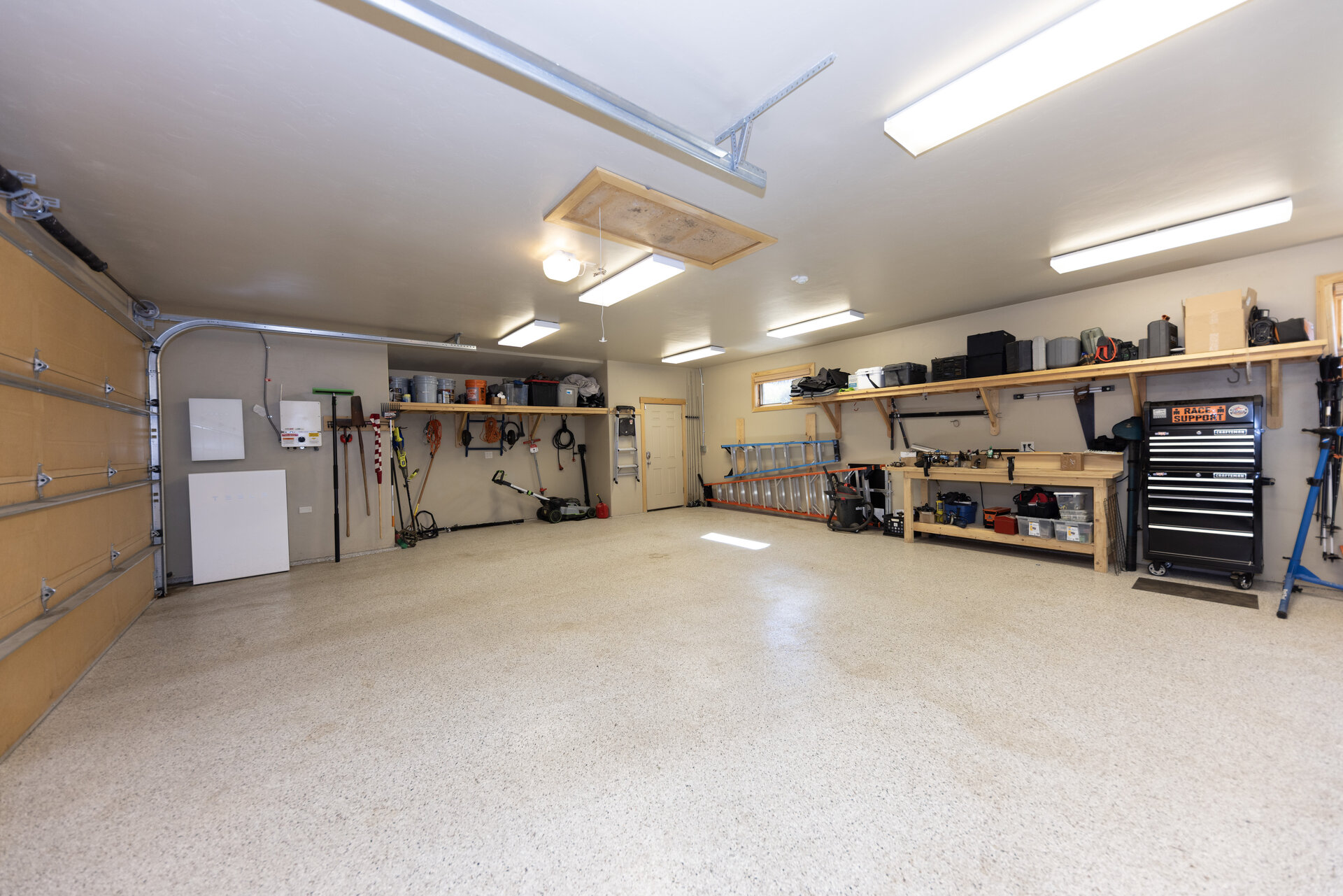 Oversized three car garage with epoxy floor