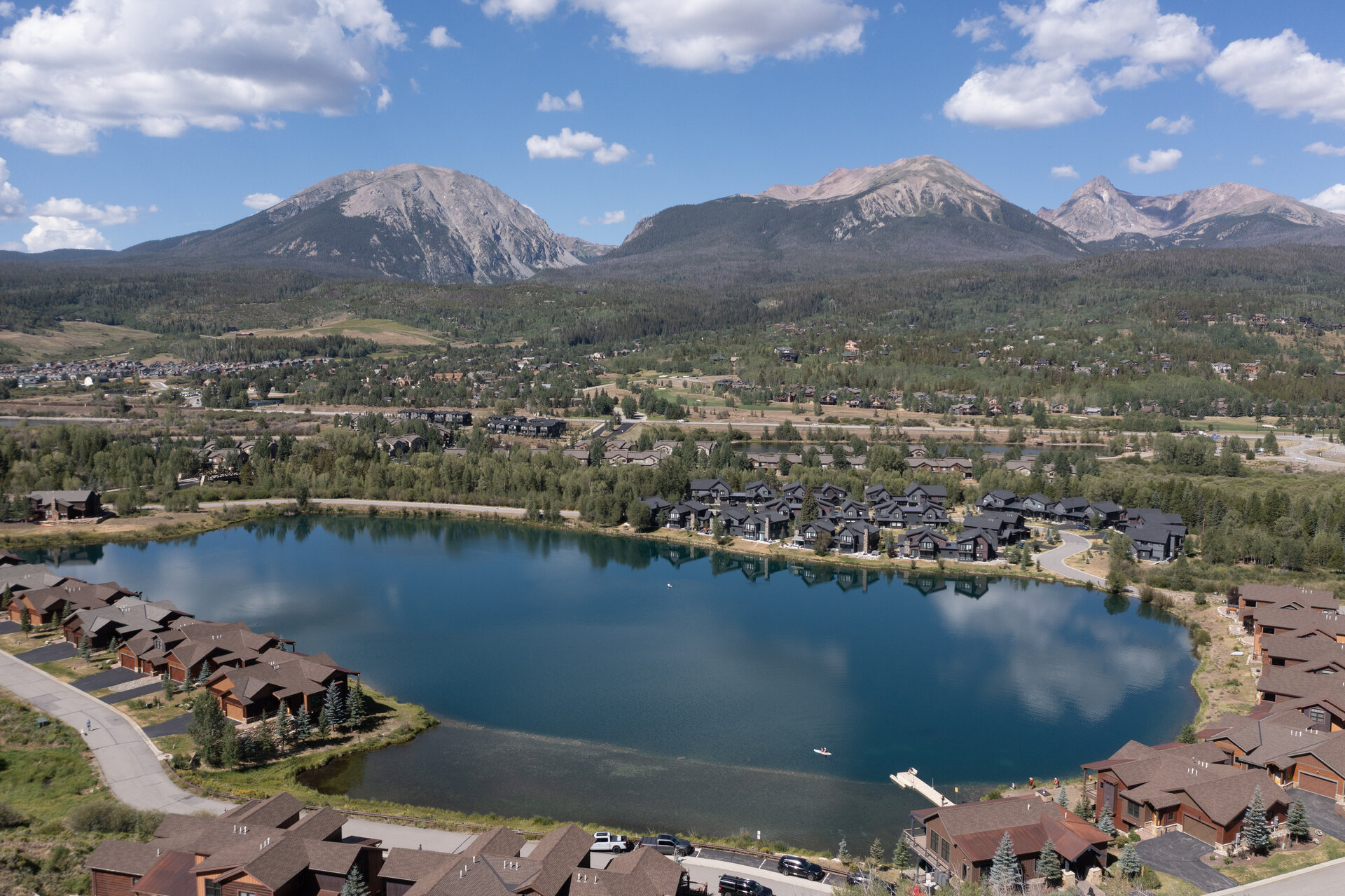Aerial of the lake and neighborhood in the mountains