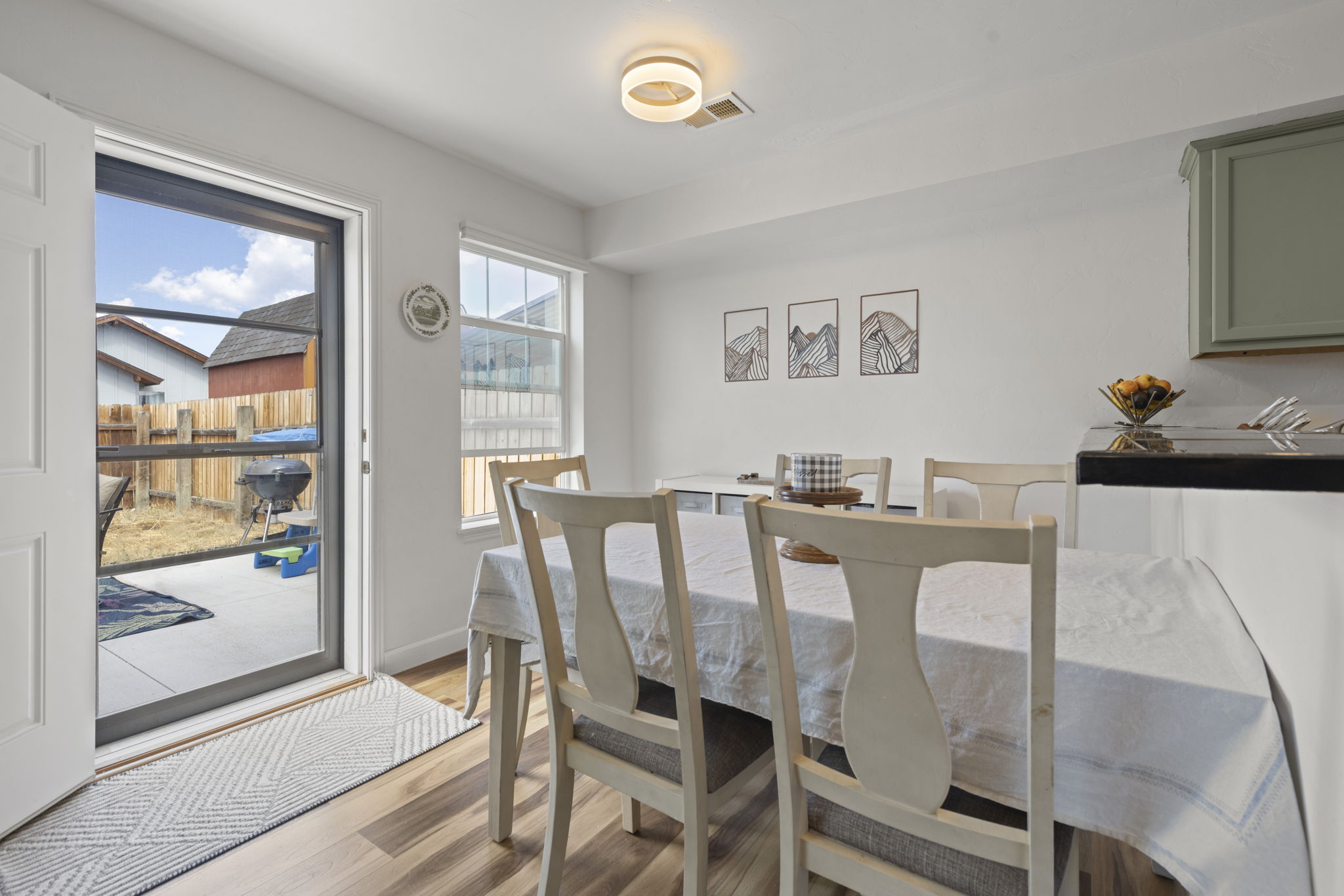 Dining area with slider to the backyard in the Kremmling home