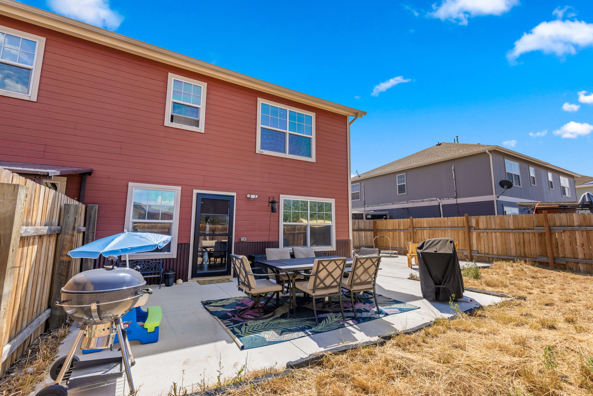 Patio with grill and seating in the backyard at 509 N 12th Street A