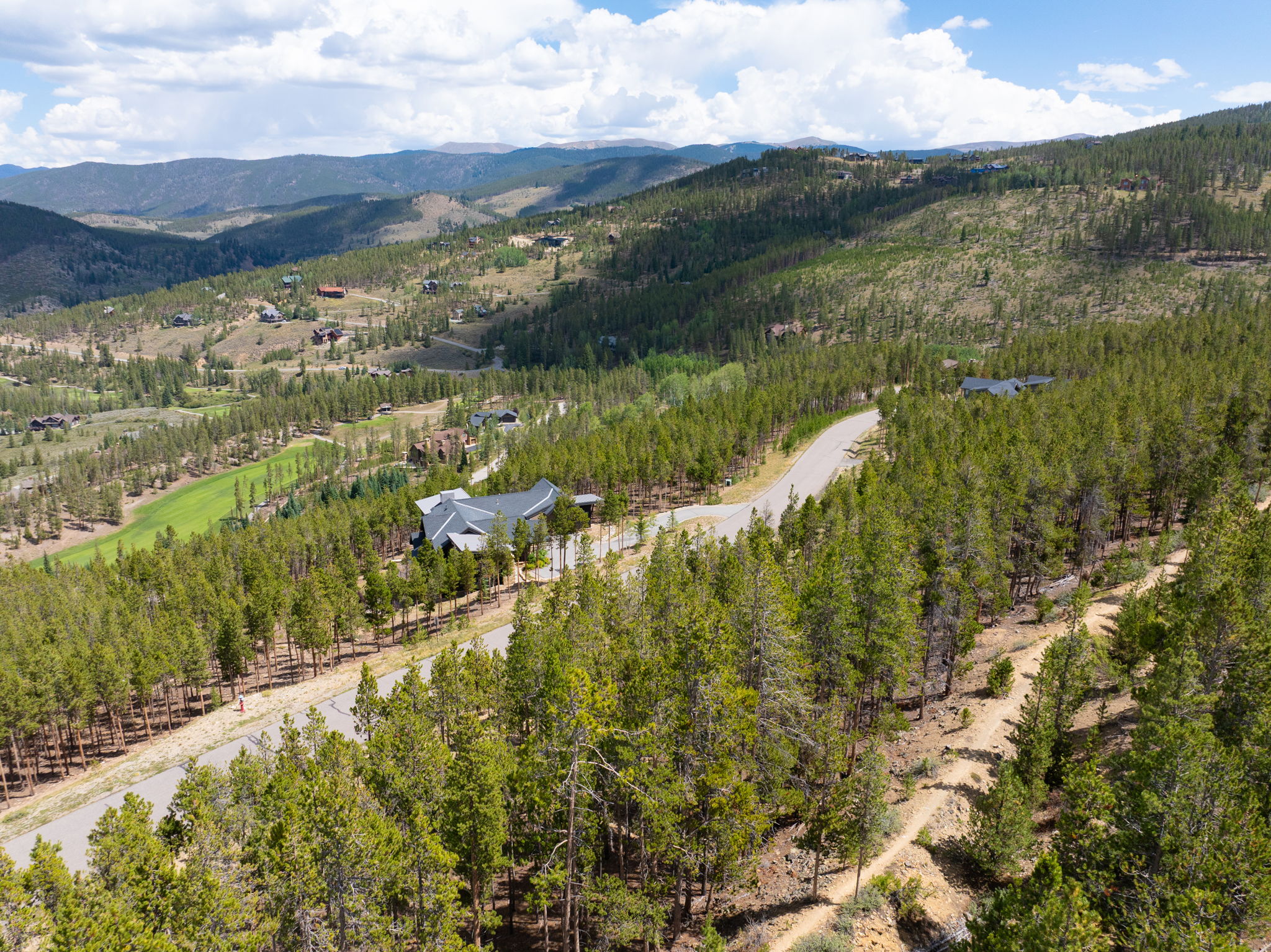 Neighboring homes in the Highlands at Breckenridge with the valley beyond