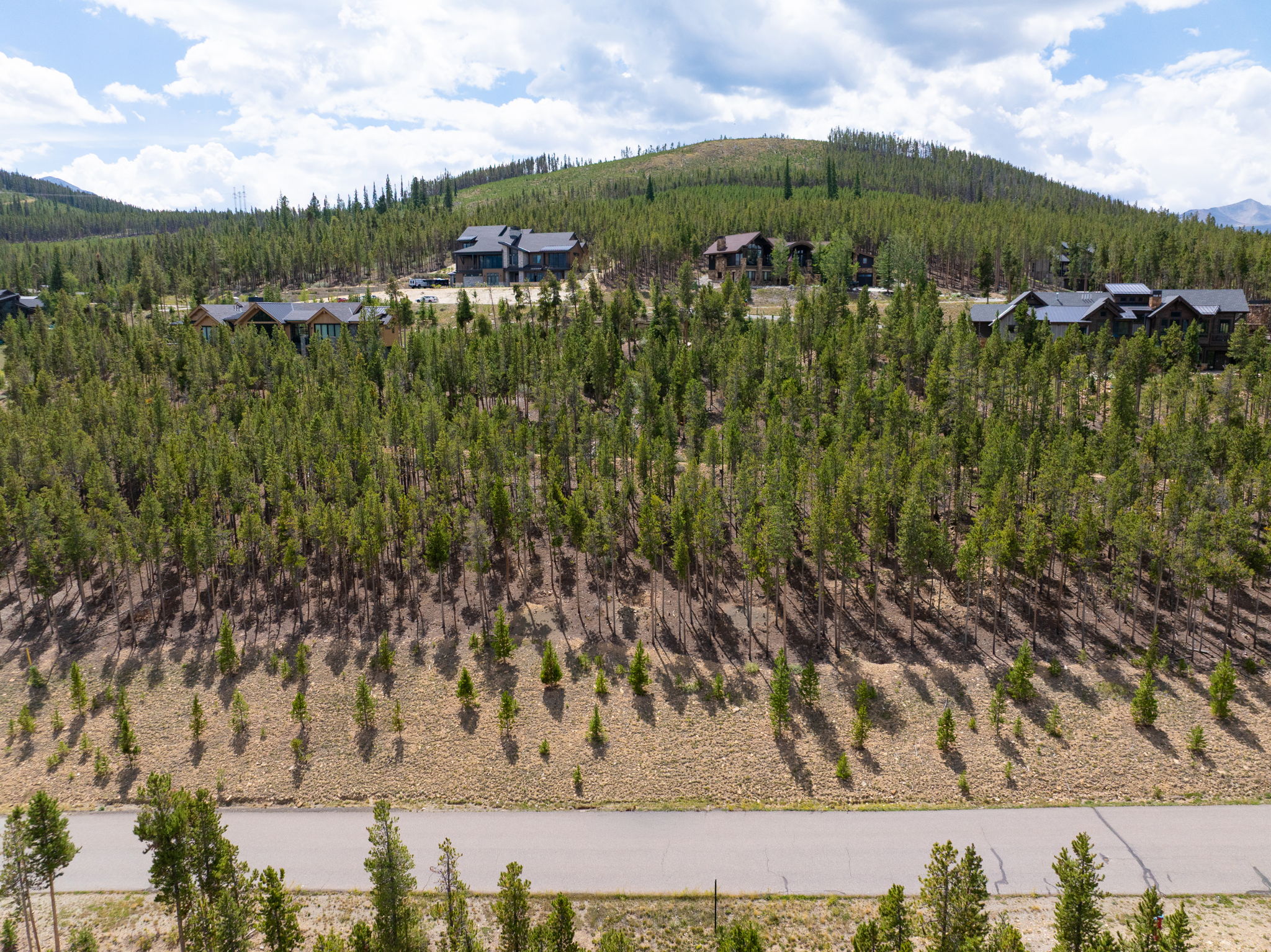 Lot 120 from street level with homes on the ridge above