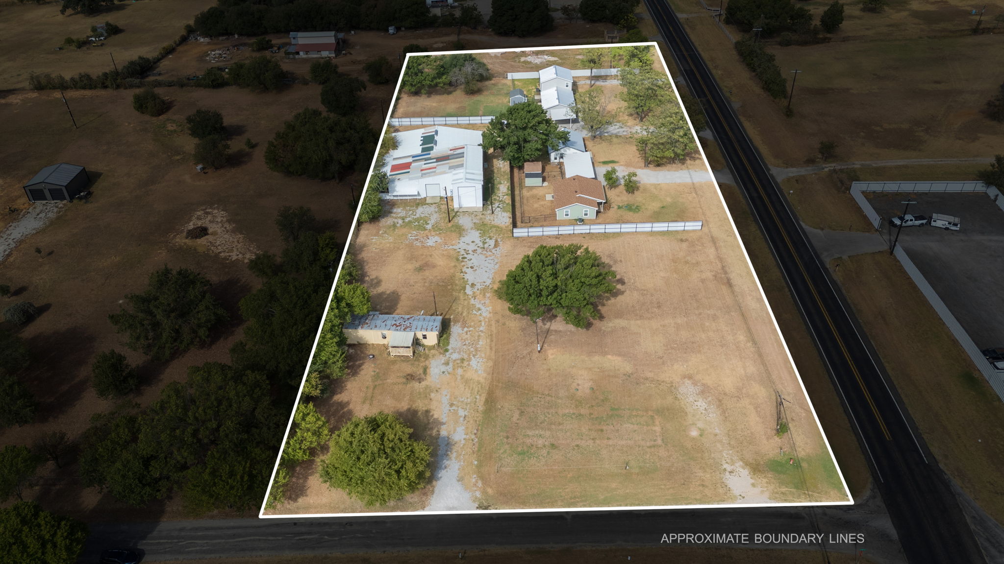 Actual aerial photograph of the adjoining commercial and residential investment properties at E Reno Rd and Arvel Cir in Reno Texas