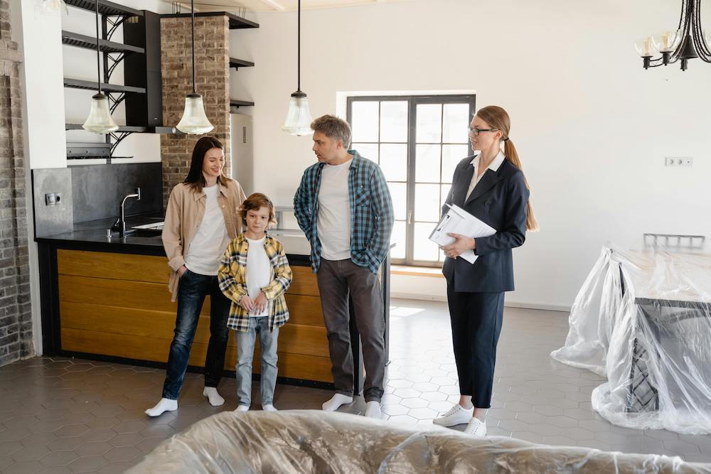 Agent showing a house to a family