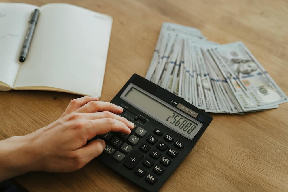 Calculator and money on a table