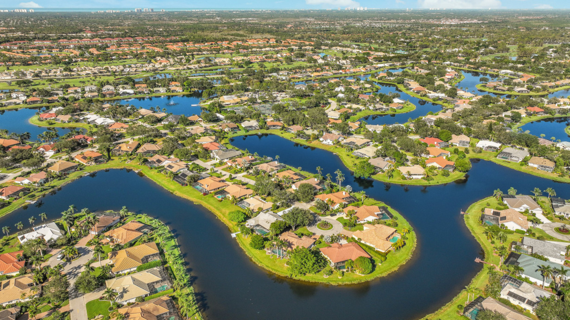 Aerial view of a luxury gated community in Naples Florida showing estates and manicured grounds