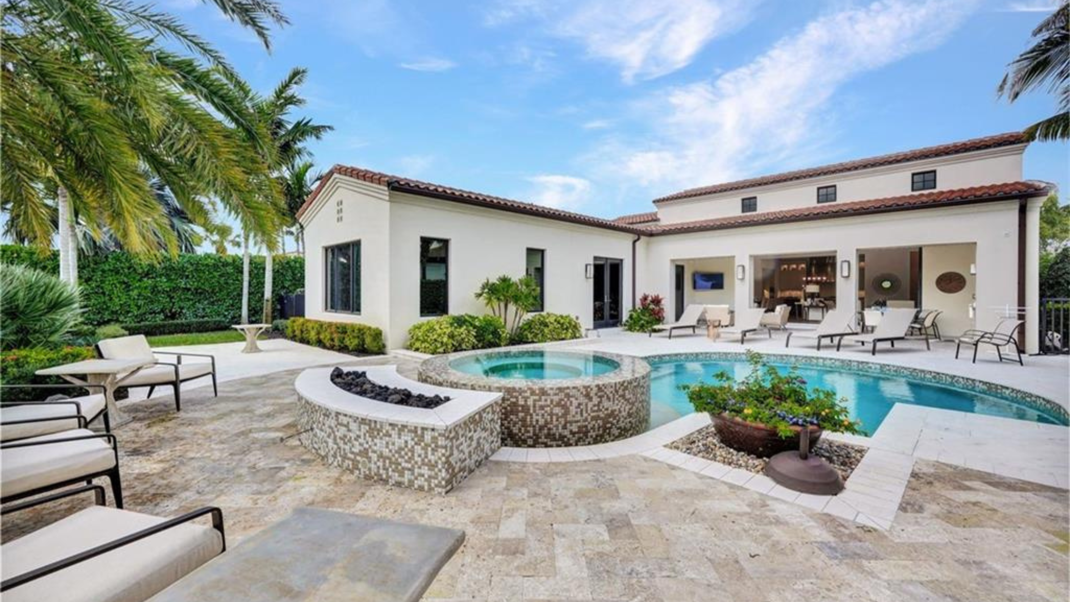 Luxury pool and outdoor living area at a Mediterra home in Naples Florida gated community